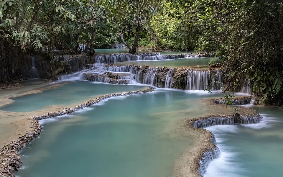 Laos — Kuang Si Falls and its turquoise tiered water pools in Luang Prabang province Laos
