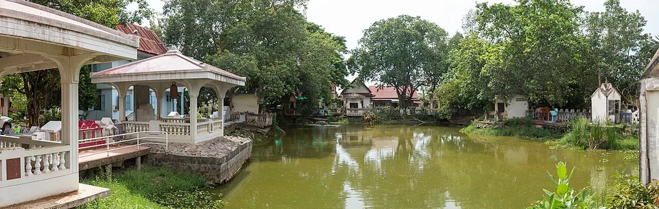 Waterside pavilion surrounded by trees — Udon Thani Province, Thailand