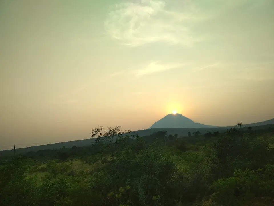 Mountain beyond fields at sunrise — Andhra Pradesh, India