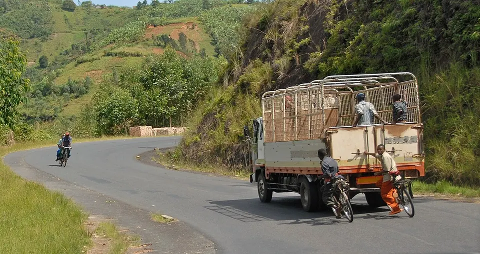 Truck and bicylists near Gitega, Burundi — Gitega, Burundi