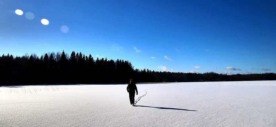 Winter landscape and a cross-country skier — Tavastia Proper, Finland