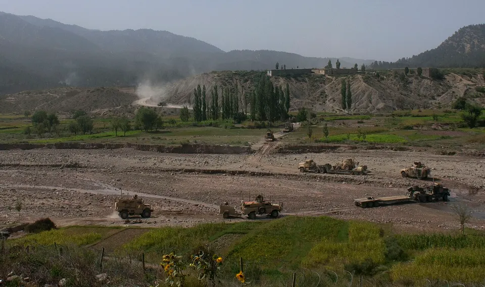 A convoy with members of Task Force 2-28, 172nd Infantry Brigade and the Afghan National Army winds its way through a small valley - 110917-A-ZU930-006 — Paktika, Afghanistan