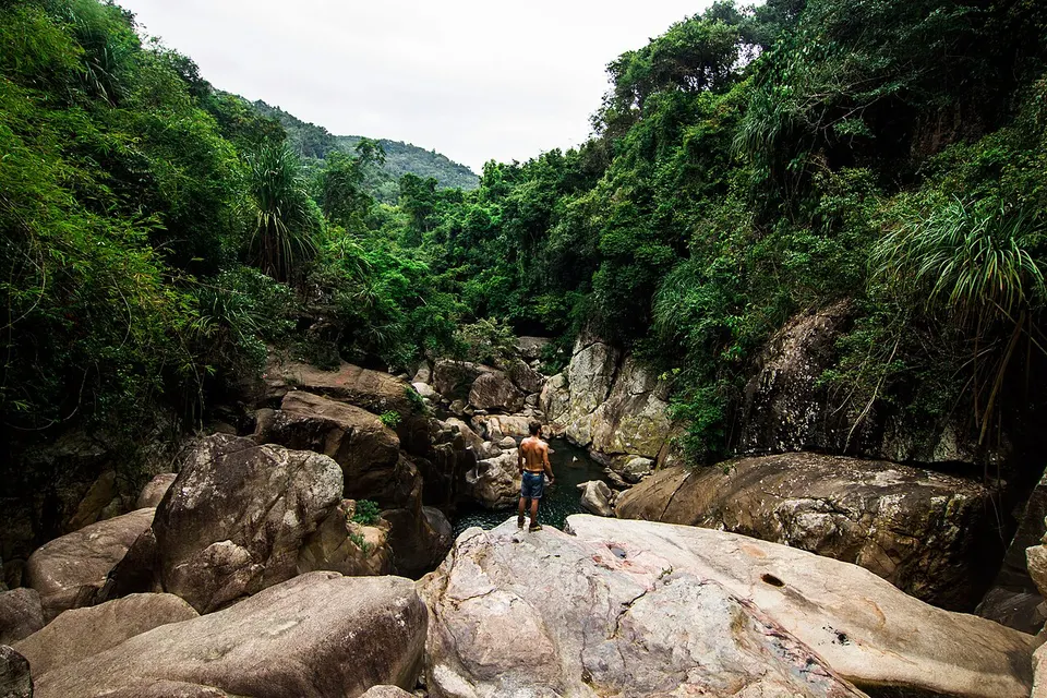 Shirtless man over a river (Unsplash) — Khánh Hòa, Vietnam
