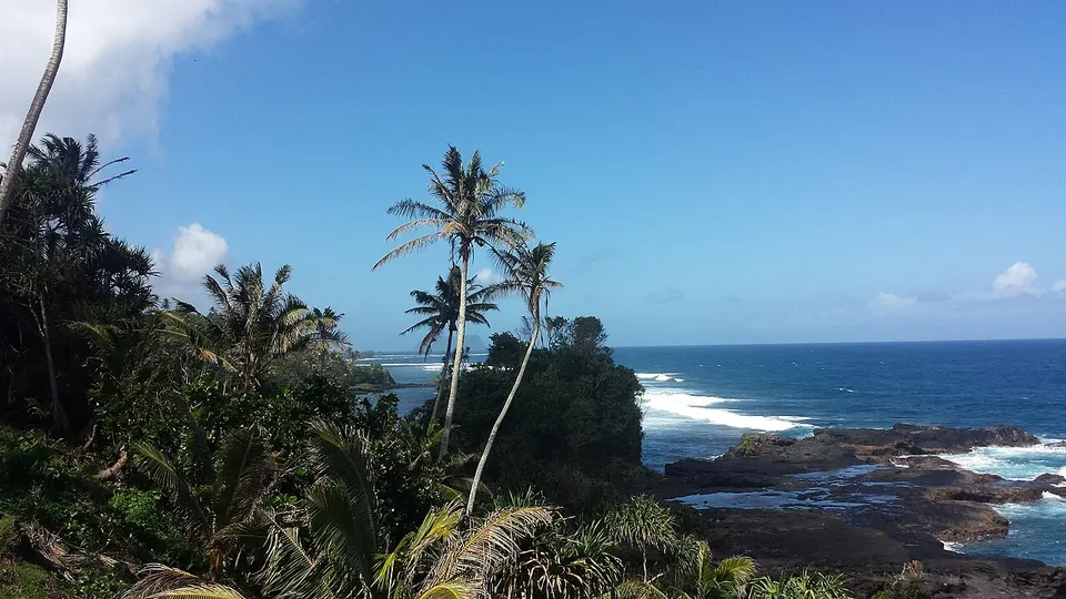Rocky coastline and palm trees — Atua, Samoa