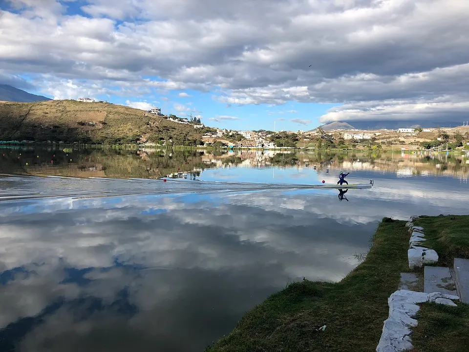 Canoe on a still lake (37634281976) — Ibarra, Ecuador