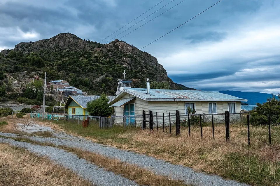 Puerto Sanchez, church, museum and old mine in the background (39553852882) — Provincia de General Carrera, Chile