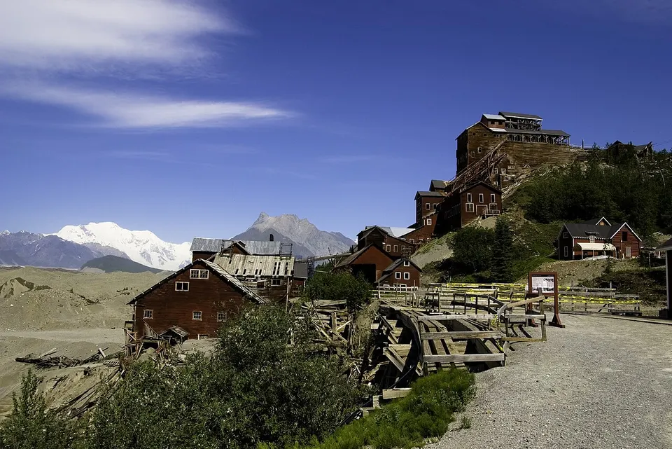 Historic mining buildings below mountains — Valdez-Cordova, United States